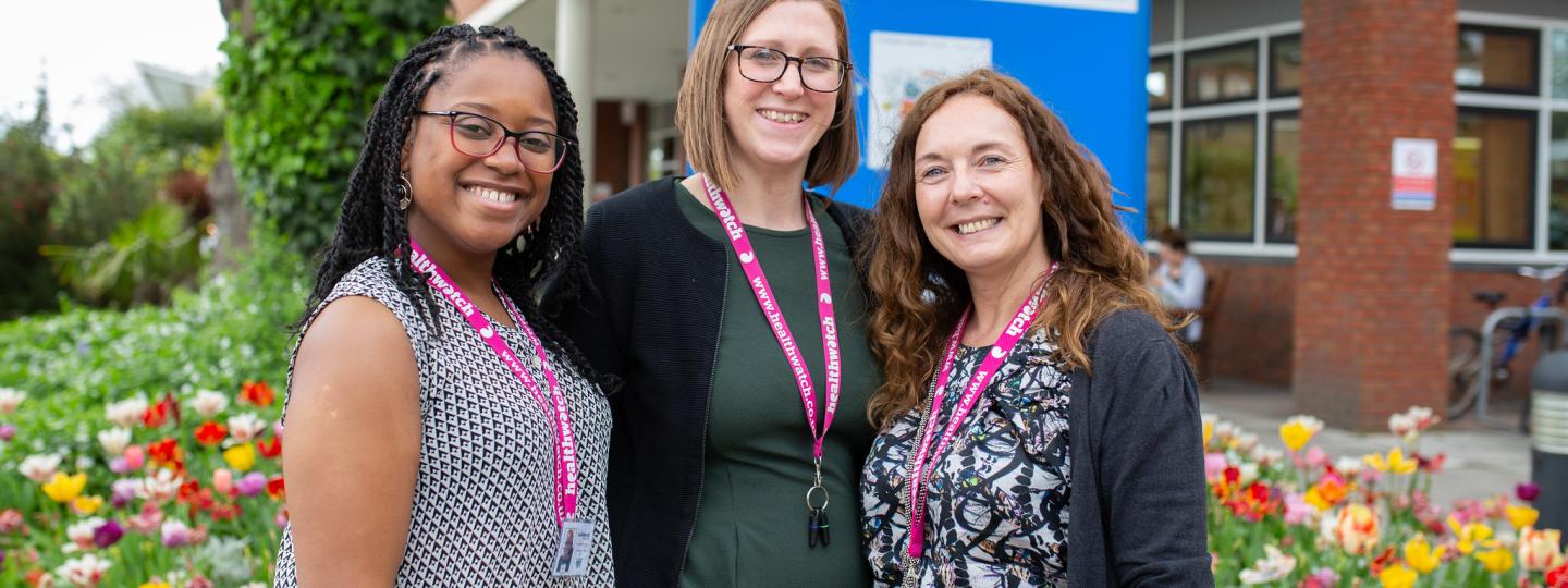 Group of Healthwatch staff members standing outside a hospital